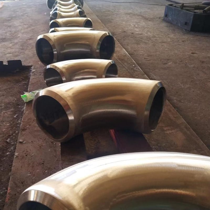 P22 chrome-moly long radius elbows after machining in the workshop